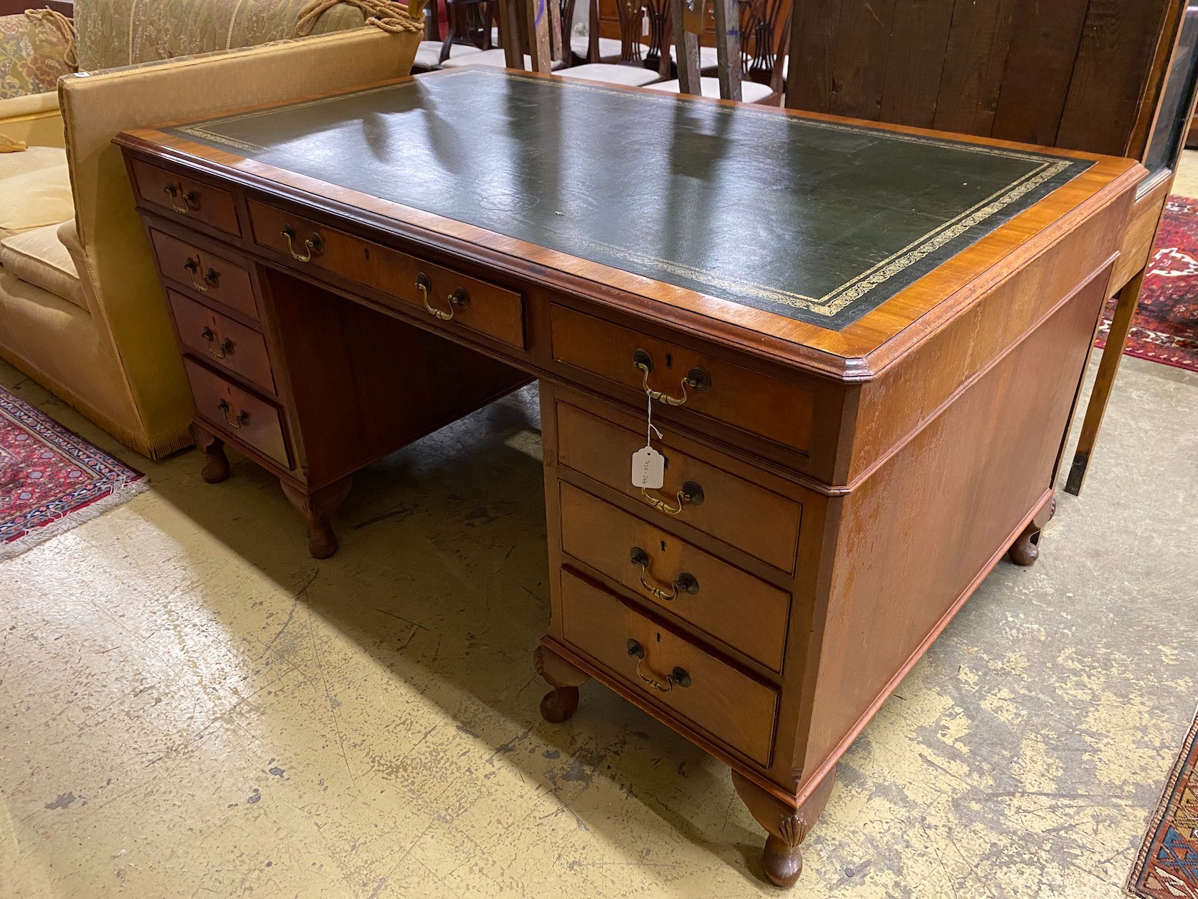 A reproduction George III style walnut pedestal desk, length 152cm, depth 91cm, height 77cm